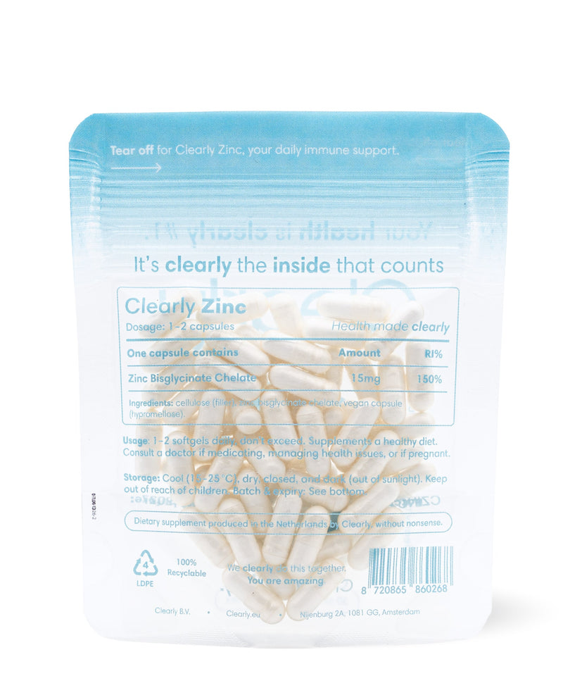 Clearly Zinc supplement bottle with a white label and zinc tablets inside, showcasing the product's packaging and tablets.